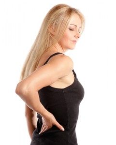 Image of a woman holding her back
