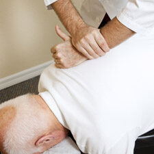 Image of a man getting an adjustment