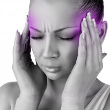 Image of a woman holding her head