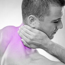 Image of a man holding his neck
